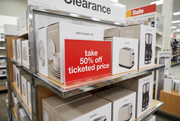 50% off ticketed price shelf sign in a retail display