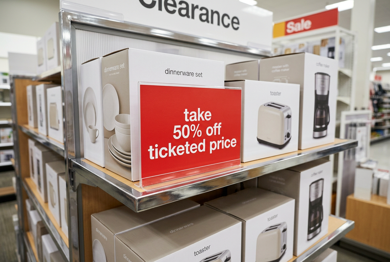 50% off ticketed price shelf sign in a retail display
