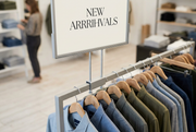Apparel rack sign frame in a clothing boutique