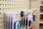 Black rubber product stop on a retail peg hook