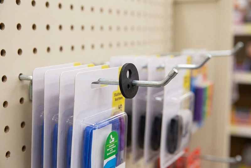 Black rubber product stop on a retail peg hook