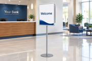 Double-sided snap-frame sign stand in a bank lobby