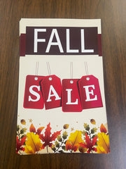 A Fall Sale shelf sign featuring red and brown autumn-themed graphics with the text 'FALL SALE' and tag symbols.