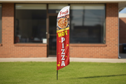 Fresh Hot Pizza feather flag in grass