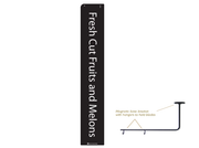 A black sign with white text that reads 'Fresh Cut Fruits and Melons' with an illustration of a magnetic sign holder.