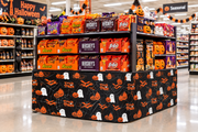 Ghosts & Pumpkins corrugated base pallet wrap on a grocery store Halloween end cap display