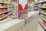 Gondola-top Super Grip sign holder in a supermarket display