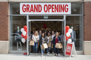 Grand Opening Vinyl Banner White Red Retail Storefront Lifestyle