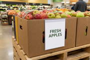 Clear box-edge sign holder with a Fresh Apples insert on a supermarket produce display