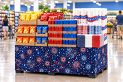 Fireworks Corrugated Base Pallet Wrap, 42 in x 25 ft, red white and blue firework burst print wrapping a supermarket pallet display of summer snacks, drinks and patriotic paper goods