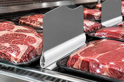 White meat case divider base with blank upright gray sign insert separating packaged beef in refrigerated display