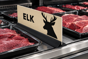Illustrative elk meat case divider in a low-profile black extrusion base among unlabeled trays in a supermarket meat case