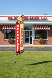 Breakfast Served All Day feather flag standing on green grass in front of diner on aluminum pole with ground spike