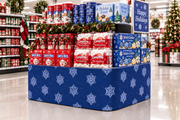 Snowflakes corrugated base pallet wrap on a retail store winter holiday end cap display