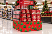 Christmas Trees corrugated base pallet wrap on a grocery store Christmas Specials end cap display