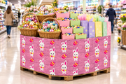 Easter Corrugated Base Pallet Wrap, 48 in x 25 ft, pink bunny and egg print wrapping a supermarket pallet display of Easter baskets, chocolate eggs and gift bags
