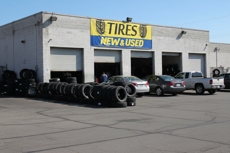 New & Used Tires Yellow Vinyl Banner Tire Shop Exterior Lifestyle