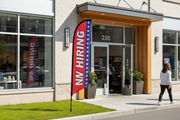 Now Hiring Feather Flag – Grass Setting