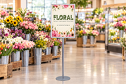 Portrait floral snap-frame stand in a supermarket