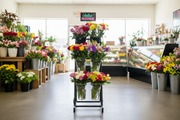Six-vase floral cart at a florist entrance