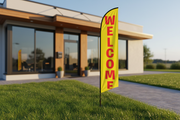Yellow Welcome feather flag in grass