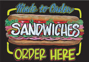 Double-sided deli chalkboard sign with 'Made to Order Sandwiches Order Here' text and an illustration of a sandwich on one side and a plain black area for writing on the other.