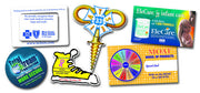 A collection of various custom printed magnets, featuring different shapes, designs, and colors.