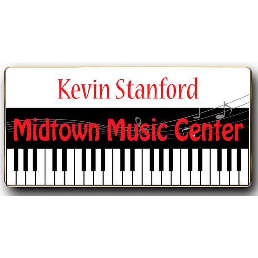 A rectangular metal name badge with a magnetic attachment, featuring the name Kevin Stanford and the Midtown Music Center logo.